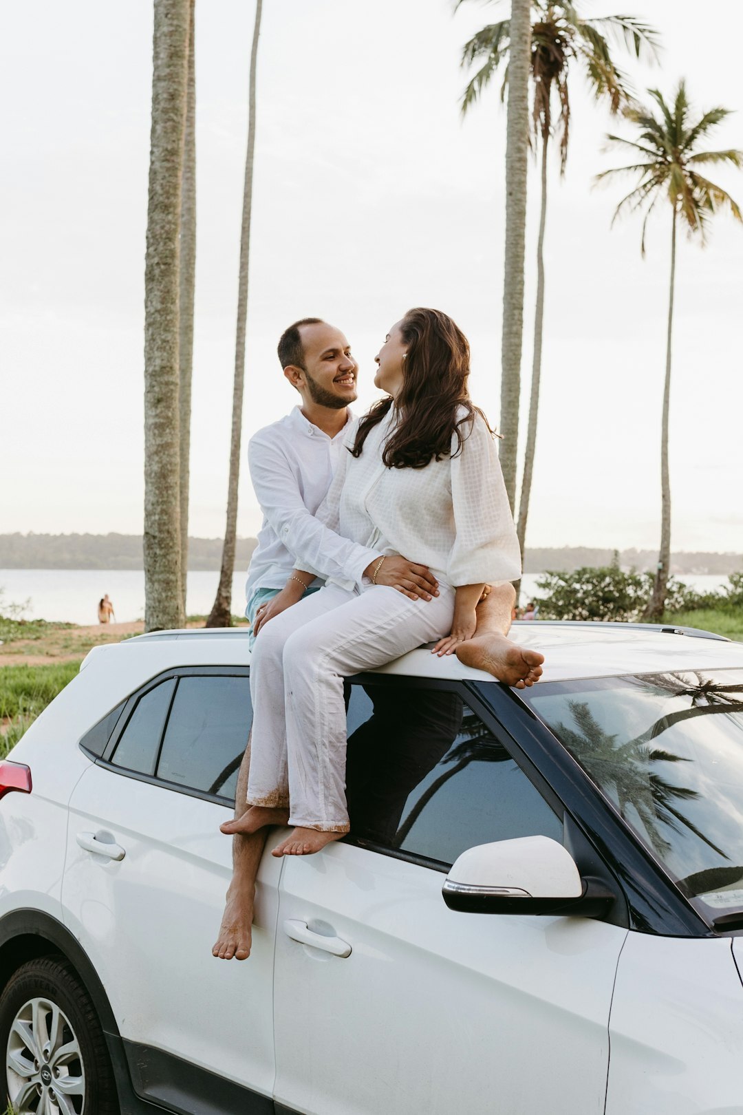 happy couple with new car