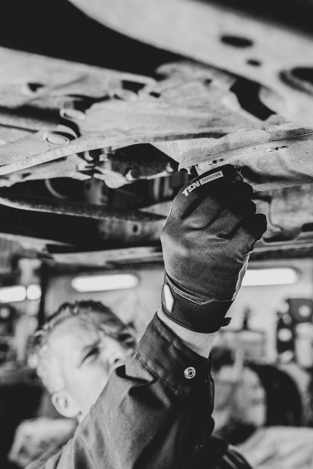 person inspecting used car